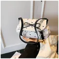 White cloud bag with black bow tie prints and leather strap for a sweet fashion look - With Pendant / White
