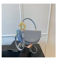 Modern light blue matte leather saddle bag with round handle and gold hardware - Blue / One Size