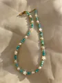 Handgefertigte Perlenkette mit blauen Steinen, Muschelsternen und 18k Goldbeschichtung - Himmelblau Perle Schale Stern Bohemien (48 Halskette)