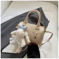 Beige Boston bag with colorful embroidery and plush bunny charm on white leather - Multicolor Embroidery Monogram Style And White Plush Bunny Pendant