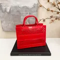 Red hollow-out woven tote bag with classic diamond mesh design for summer beach shopping - Red