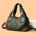 Dark green faux leather satchel handbag with kangaroo logo and adjustable shoulder strap - One Size / Green