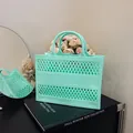 Mint green hollow jelly tote bag with diamond mesh design and dual handles for summer - Green