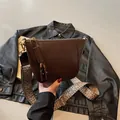 Dark brown half-moon crossbody bag with vintage geometric strap and golden hardware - One Size / Coffee