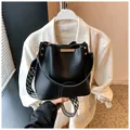 Black matte bucket bag featuring a stylish black and white herringbone wide strap - One Size / Black
