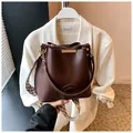 Dark brown bucket bag with textured wave shoulder strap and smooth leather finish - One Size / Coffee