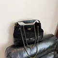 Elegant black quilted tote bag in mixed leather with gold chain strap and turn-lock - Black / One Size
