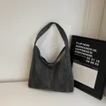 Large capacity tote bag in dark gray washed denim with a minimalist trapezoid silhouette - Black