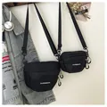 Waterproof black nylon crossbody waist bag shown in medium and small sizes - Large / Black