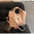 Modern pink leather handbag with silver triangle logo and pleated handle detail - One Size / Pink