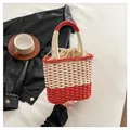 Handwoven straw crossbody bag in vibrant red and white contrast colors with drawstring - One Size / Red