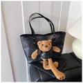 Black bear print tote bag made of lychee leather with cute plush bear charm - Black
