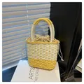 Yellow and white woven straw handbag with drawstring lining for summer fashion look - One Size / Yellow