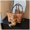 Brown faux leather tote bag with cartoon bear prints and a plush teddy bear pendant - Brown