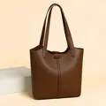Caramel brown pebbled leather tote bag with long straps and embossed kangaroo logo - One Size / Coffee