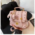 Sac à dos rose en similicuir avec motif NK et charmant petit pendentif en forme d'éléphant - Rose Clair