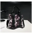 Black tote bag with skull and flower print including adjustable shoulder strap - Red