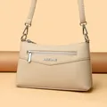 Elegant beige pebbled leather shoulder bag with front zipper and long strap - One Size / Apricot