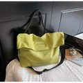 Lime green high capacity tote bag with black rope handle and adjustable crossbody strap - One Size / Green
