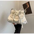 Chic beige bow-knot shoulder bag with pebbled leather texture and ruffled design - One Size / Off White