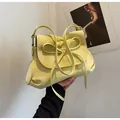 Light yellow oversized casual tote bag with a large decorative bow and leather texture - One Size / Light Yellow