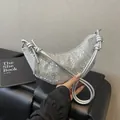 Silver sequin crescent dumpling bag with knotted strap and tassel detail - Wave Silver