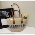 Detail of color-block straw tote featuring woven stripes and brown leather handles - One Size / Cream with Blue
