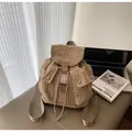 Plaid canvas backpack in beige and coffee with flap closure and double front pockets - One Size / Khaki