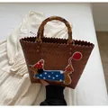 Brown hand-woven tote bag with dachshund embroidery and natural bamboo handle - Blue Dog
