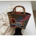 Rainbow woven tote bag with dachshund embroidery and bamboo-style top handles - Striped Dog