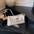 Retro white PU leather shoulder bag with metallic eyelets and stud detailing on stairs - One Size / White
