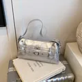 Y2K style silver metallic shoulder bag with buckle straps and punk hardware - One Size / Silver