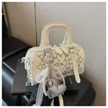 Detail of white cylinder Boston bag with silver rivets and heart pearl charm - With Pendant / Off White