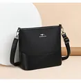 Detail of black bucket bag with kangaroo metal logo and adjustable leather strap - Black