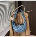Blue denim crescent crossbody bag with multiple zip pockets and adjustable strap - One Size / Light Blue