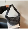 Charcoal grey denim crescent crossbody bag featuring multiple zipper pockets and buckles - One Size / Black