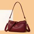 Deep red pebbled leather crossbody bag for women with gold kangaroo logo and zipper hardware - One Size / Red