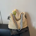 Straw beach tote with black and white striped ribbon shoulder straps and bow detail - One Size / Striped Ribbon Beige