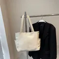 Minimalist cream white large tote bag with side pockets and smooth leather texture - One Size / Off White