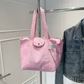 Pink canvas tote bag with side pockets and snap button closure for daily commuting - One Size / Pink