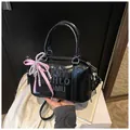 Retro black Boston bag with embossed lettering and pink bow charm for women - With Pendant / Black