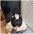 Handmade black woven bucket bag with white drawstring liner and textured knit handles - Black