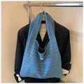 Minimalist blue striped knit tote bag with a nice day label for casual shopping - Knitted Striped / Dark Blue