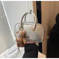 Silver metallic small square handbag with golden hardware and teddy bear charm for women - With Pendant / Silver