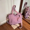 Purple nylon tote bag with front zipper pocket and round coin purse accessory - Pink