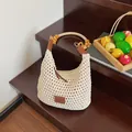 Handmade woven tote bag in beige with beaded handles and leather logo patches - Large / Beige with Label