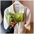 Grass green cylinder pillow bag in lychee texture leather with colorful letter charm - Light Green