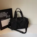 Large capacity black nylon sports bag with double top handles and adjustable shoulder strap - Black