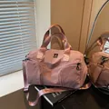 Pink matte nylon sports travel bag with dual handles and adjustable shoulder strap - Pink