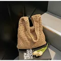 Detail of hollow-out weave bucket bag showing intricate texture and fabric inner lining - One Size / Khaki